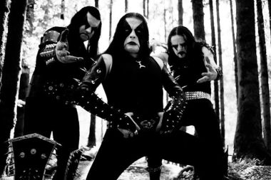 Black metal band Immortal in a classic pose in the forest